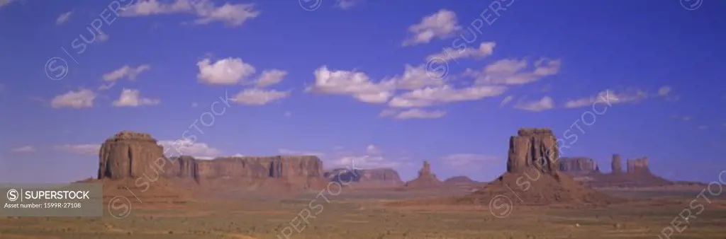 Panoramic view of red buttes and colorful spires of Monument Valley Navajo Tribal Park, Southern Utah near Arizona border