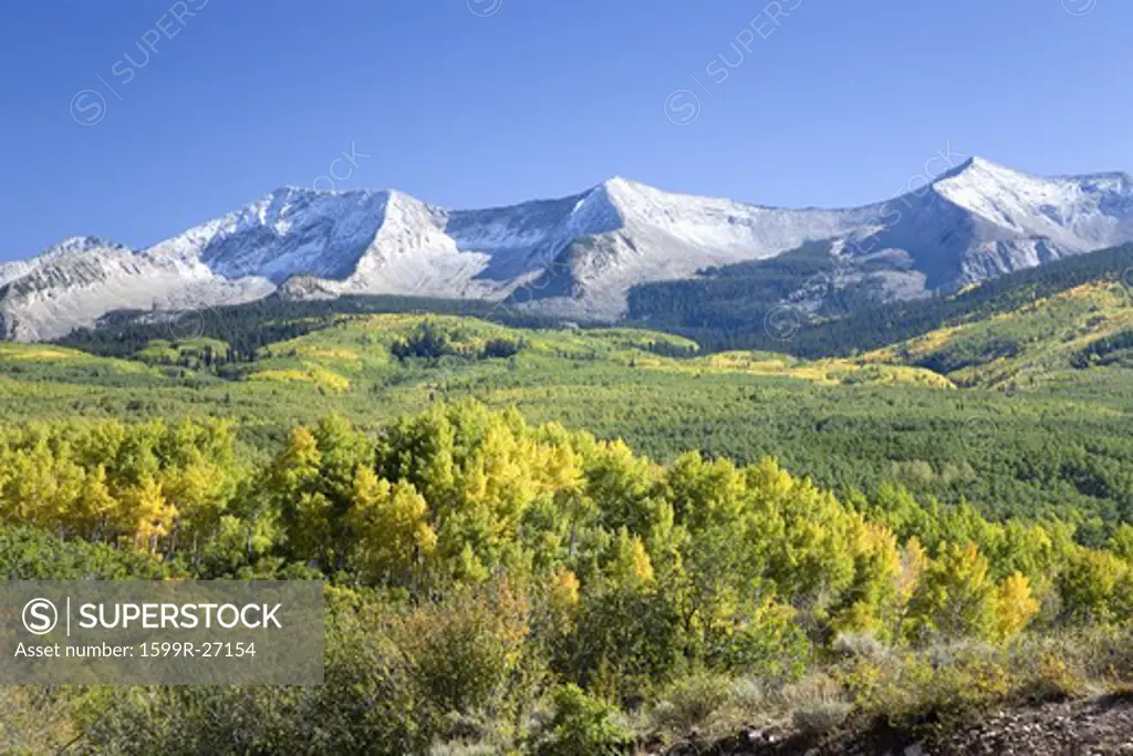 Snow capped mountains with autumn color off Route 62 west of Ridgeway toward Telluride, Colorado