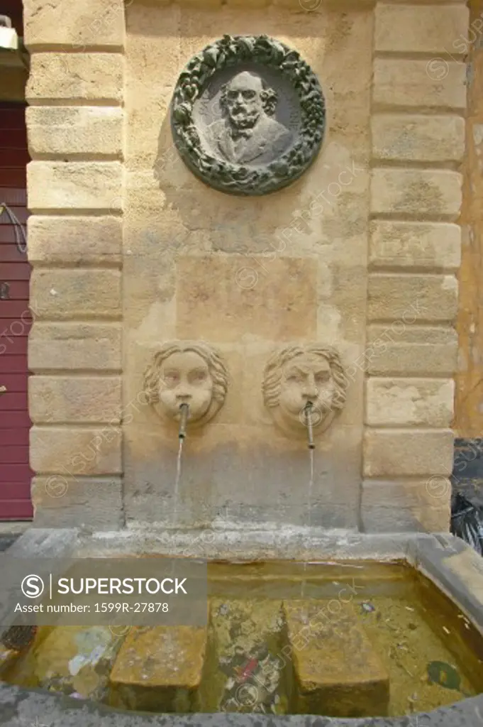 The Fountain d'Espeluque of 1618 located in Place Martyrs de la Resistance, plaque of Cezanne above, Aix en Provence, France