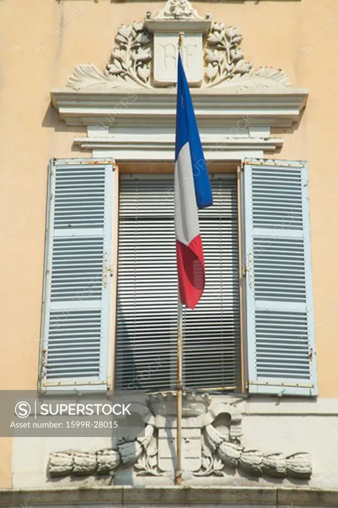 French flag flying from window, Antibes, France