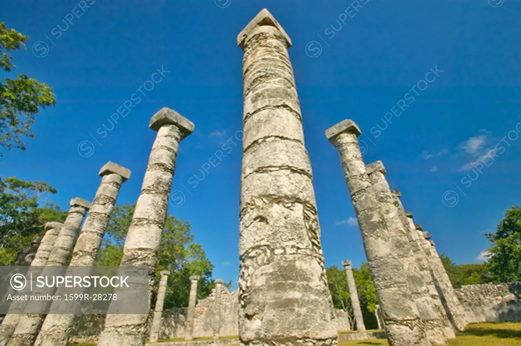 Columns surrounding grassy courtyard for ballgames at Chichen Itza, Mayan Ruins in the Yucatan Peninsula, Mexico