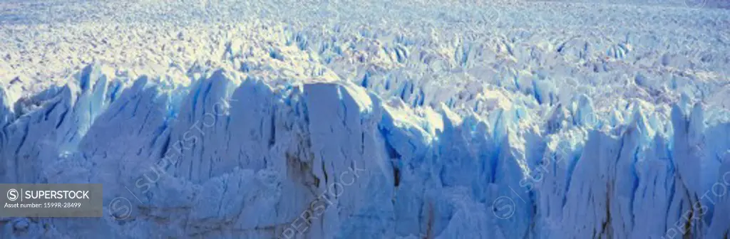 Panoramic view of icy formations of Perito Moreno Glacier at Canal de Tempanos in Parque Nacional Las Glaciares near El Calafate, Patagonia, Argentina - glacier melting as it falls into water