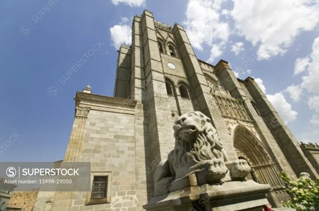 Lion statue in front of Catedral de Ávila  Ávila Cathedra, Cathedral of Avila, the oldest Gothic church in Spain in the old Castilian Spanish village of Avila