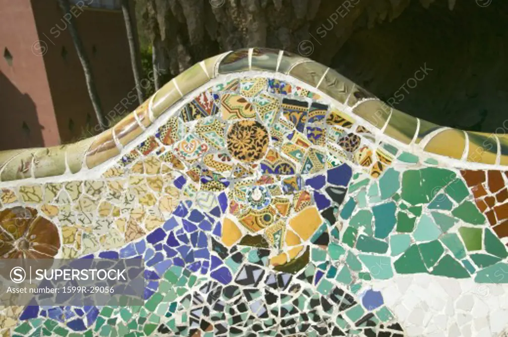 Closeup of mosaic of colored ceramic tile by Antoni Gaudi at his Parc Guell, Barcelona, Spain