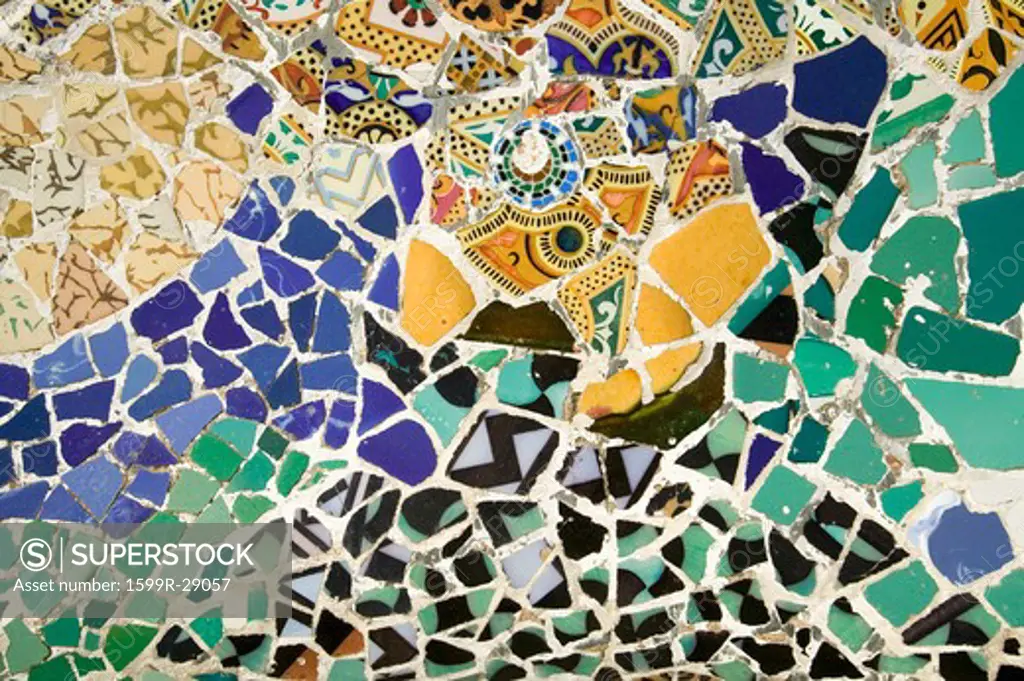 Closeup of mosaic of colored ceramic tile by Antoni Gaudi at his Parc Guell, Barcelona, Spain