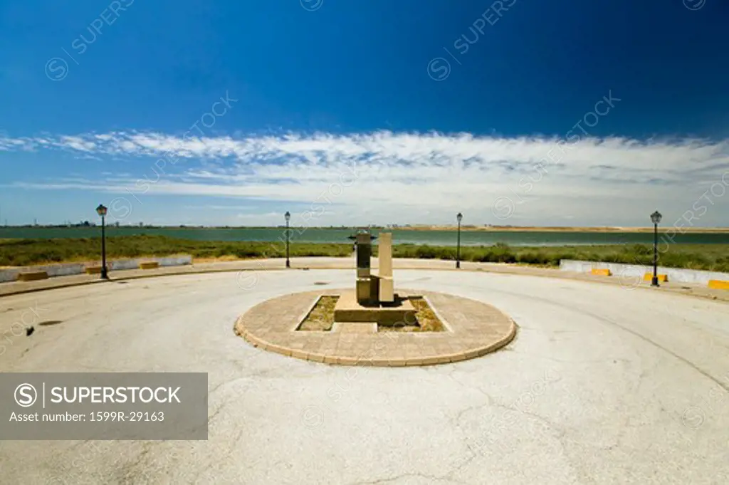 A Monument marking the precise spot where Christopher Columbus' fleet of three ships departed the harbour of Palos de la Frontera on 3 August 1492, with the Rio Tinto River and the opposite bank of the city of Huelva in the background, Southern Spain
