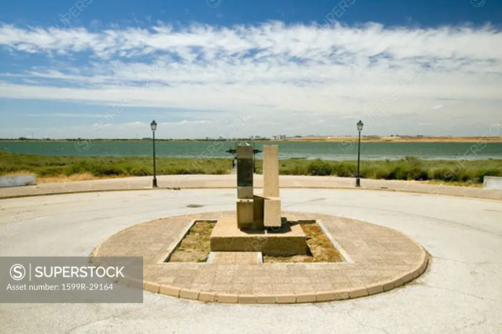 A Monument marking the precise spot where Christopher Columbus' fleet of three ships departed the harbour of Palos de la Frontera on 3 August 1492, with the Rio Tinto River and the opposite bank of the city of Huelva in the background, Southern Spain