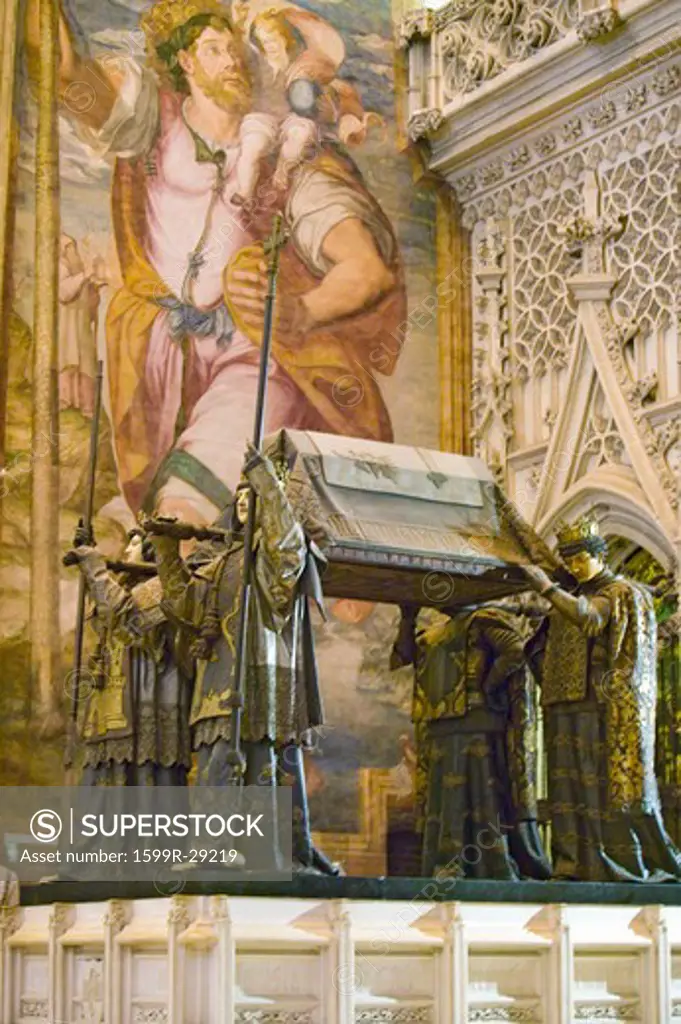 In the Sevilla Cathedral, Southern Spain, is the mausoleum-monument and ornate tomb of Christopher Columbus where four heralds dressed in full court mourning carry the sarcophagus; they bear respectively the arms of, Castile, Léon, Aragon, and Navarre, the four nations which united under the rule of Ferdinand and Isabella, constituted the kingdom of Spain. The sarcophagus is of bronze, ornamented with enameled metallic plates, and in it are the remains of Columbus, the Discoverer of the New Worl