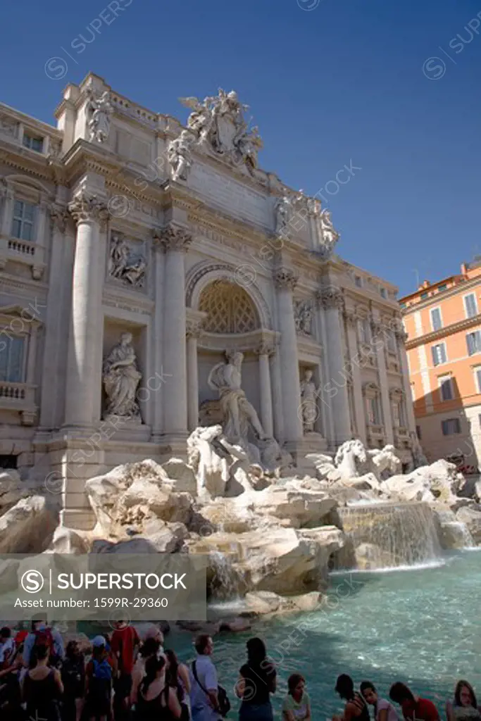 Tourists viewing Fontana di Trevi located in Piazza de Trevi in Rome, Italy