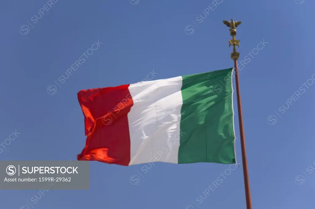 Italian flag flying in blue sky, Rome, Italy, Europe