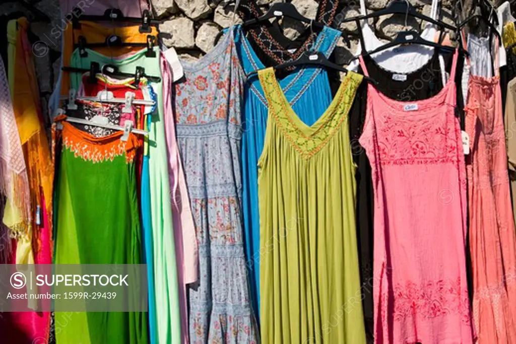 Summer dresses hanging in sunlight in Capri, Italy, Europe