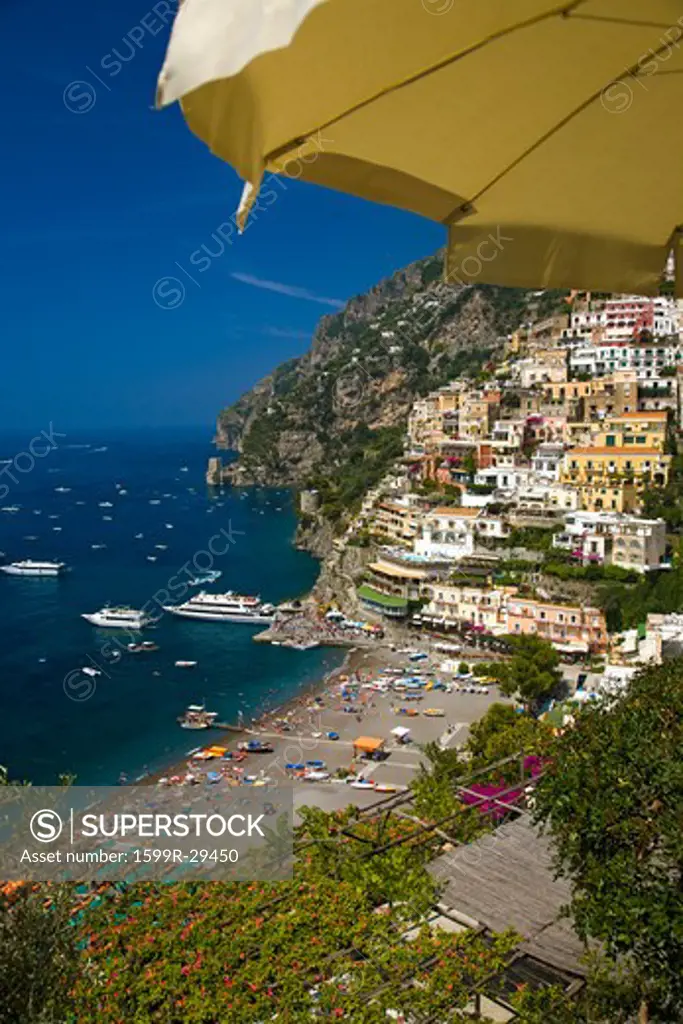 Yellow umbrella with sea view of Amalfi, a town in the province of Salerno, in the region of Campania, Italy, on the Gulf of Salerno, 24 miles southeast of Naples