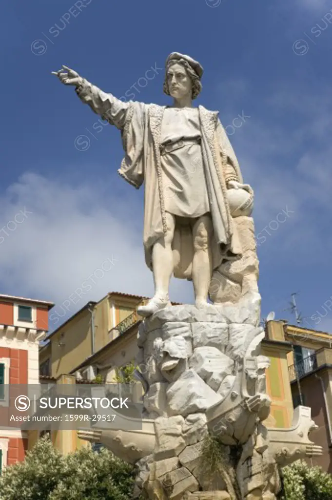 Statue of Christopher Columbus in town center pointing west in village of Santa Margarita, the Italian Riviera, Italy, Europe
