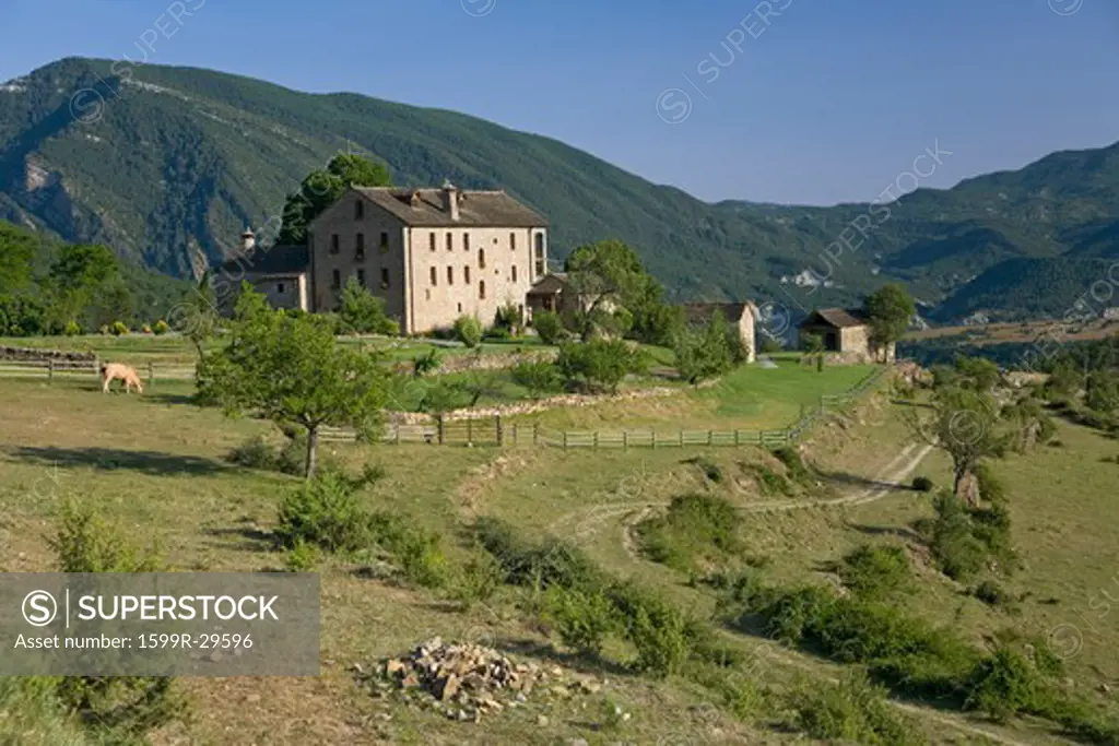Valley view and Casa de San Martin Inn, in Aragon, in the Pyrenees Mountains, Province of Huesca, Spain