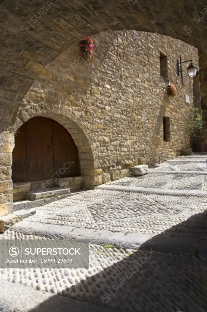 Archways on Plaza Mayor, in Ainsa, Huesca, Spain in Pyrenees Mountains, an old walled town with hilltop views of Cinca and Ara Rivers