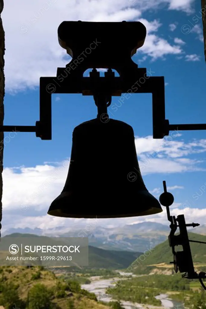 Silhouette of old church bell in Ainsa, Huesca, Spain in Pyrenees Mountains, an old walled town with hilltop views of Cinca and Ara Rivers
