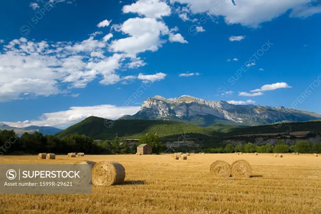 Hay bails with sweeping views of Parque National de Ordesa near Ainsa, Huesca, Spain in Pyrenees Mountains
