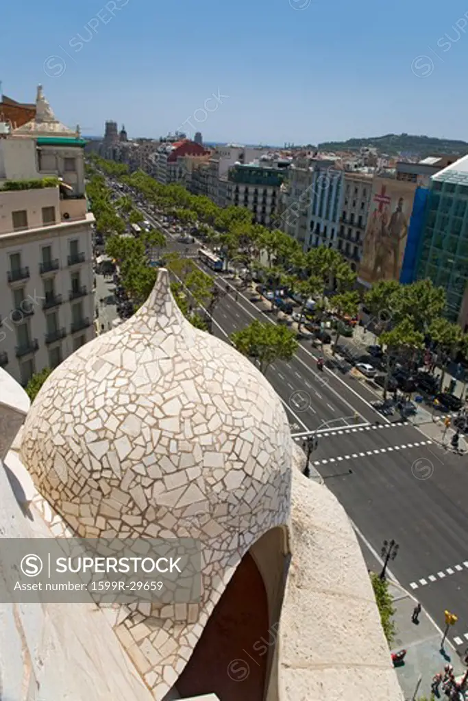 Detail of Gaudi's La Pedrera with aerial view of Passeig de Gràcia street in the Eixample district, Barcelona, Spain, Europe