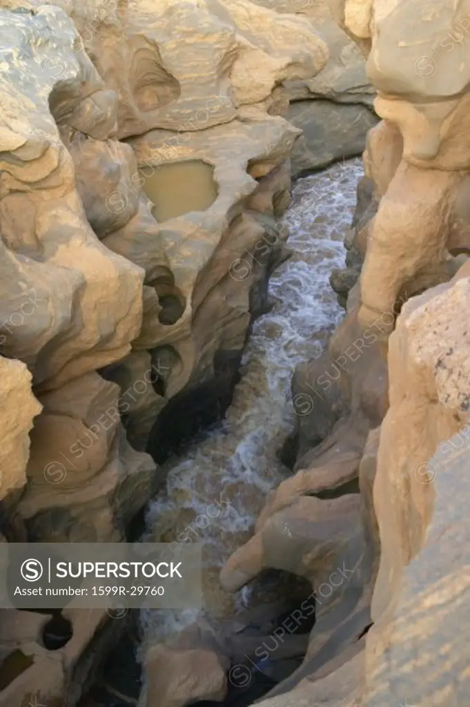 Water in ancient rocks near Tsavo National Park, Kenya, Africa