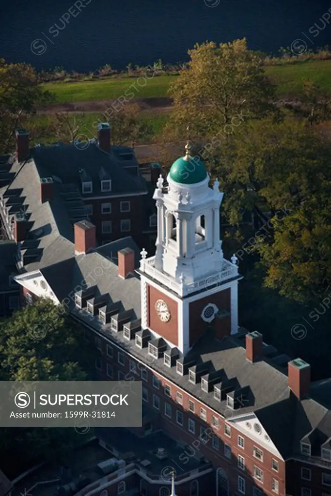 AERIAL VIEW of Harvard Campus featuring Eliot House Clock Tower along Charles River, Cambridge, Boston, MA