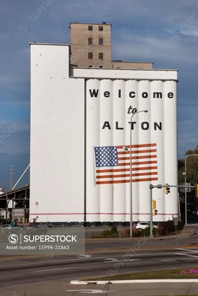 Welcome to Alton Illinois,' is painted with American flag on side of Grain Silo, along the Mississippi River along the Great River Road