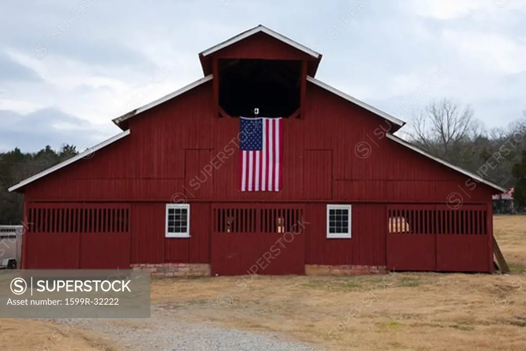 Red Barn and US Flag outside of Franklin, Tennessee, a suburb south of Nashville, Williamson County, Tenn.