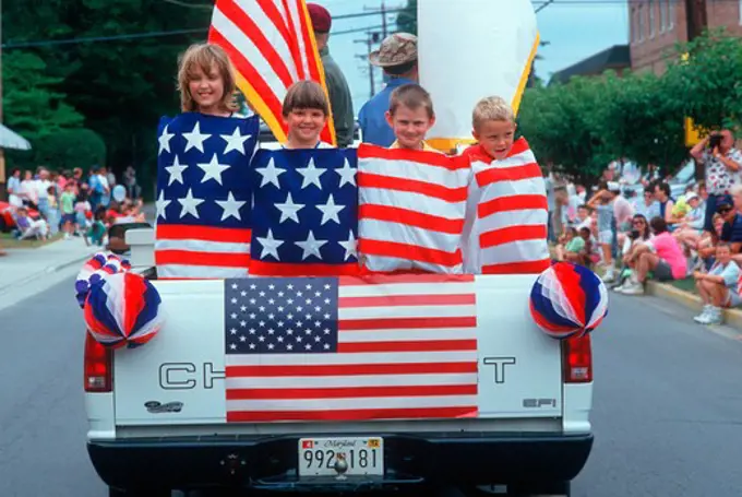 Children wrapped in an American flag for an Independence Day Parade, East Shore, MD