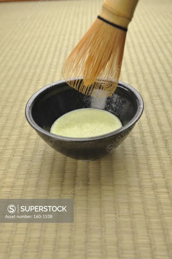 Close-up of a tea whisk and Maccha tea in Japanese tea ceremony