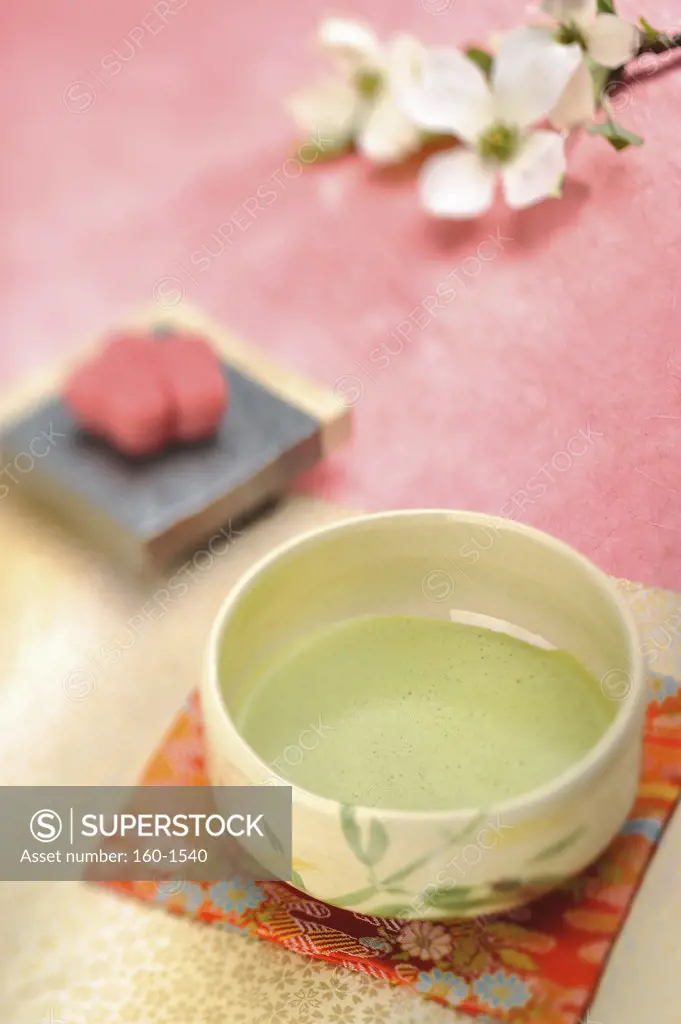 Maccha tea served with a teacake in Japanese tea ceremony