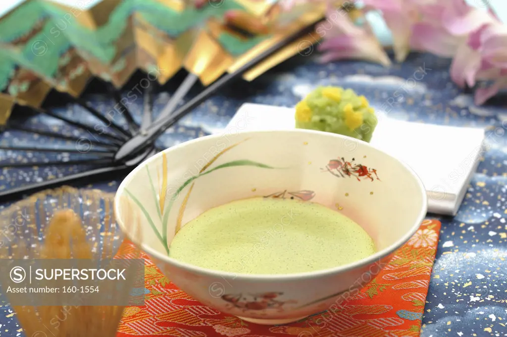 Maccha tea served with a teacake in Japanese tea ceremony