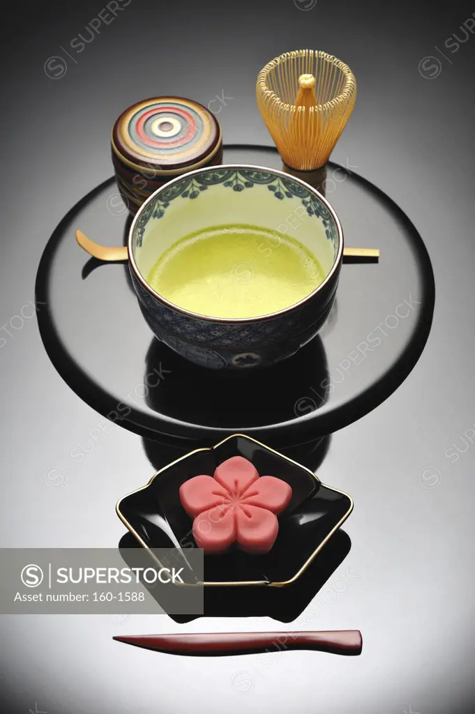 Japanese tea cup with a tea whisk and Nerikiri the traditional Japanese sweet on a tray