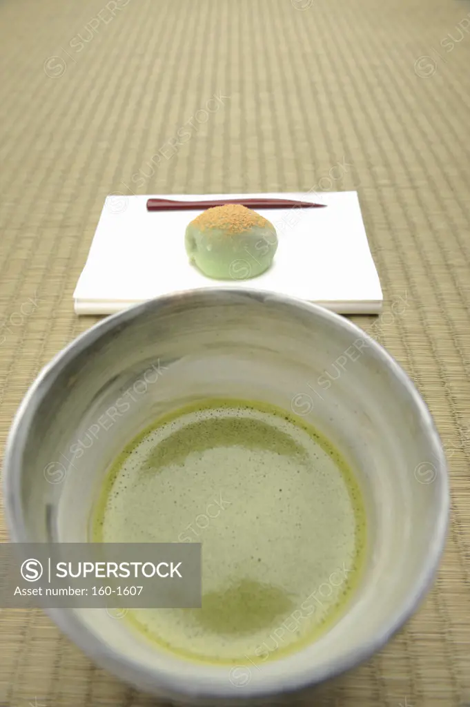 Japanese tea cup with Nerikiri the traditional Japanese sweet on a tray
