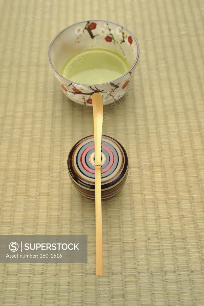 Close-up of a Japanese tea cup with a tea scoop