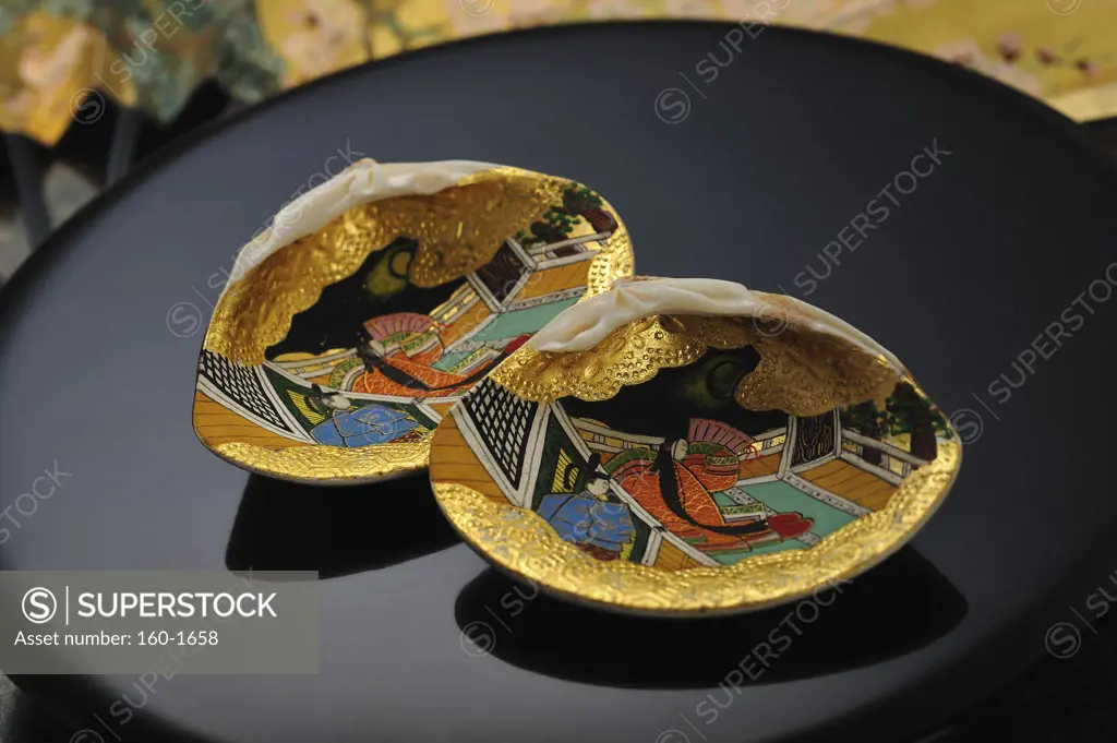 Close-up of decorated shells in a tray