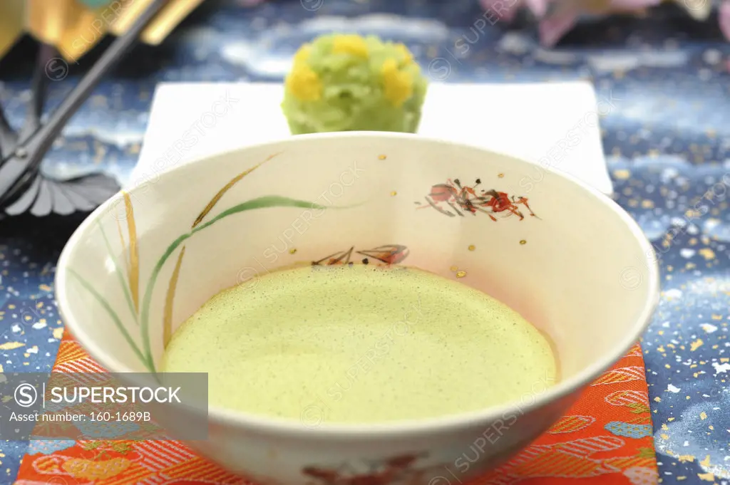 Maccha tea served with a teacake in tea ceremony