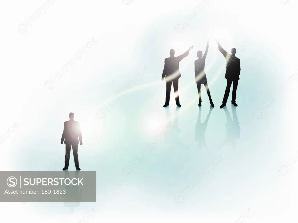 Silhouette of business people in light