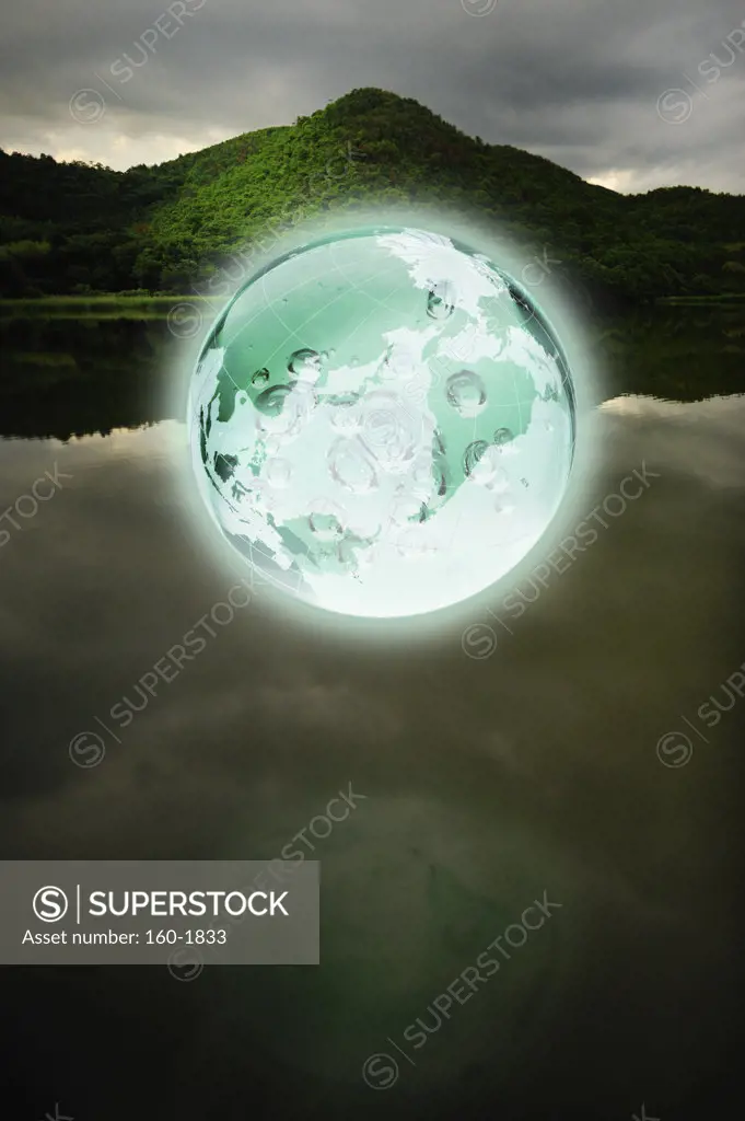 Glowing Earth over lake