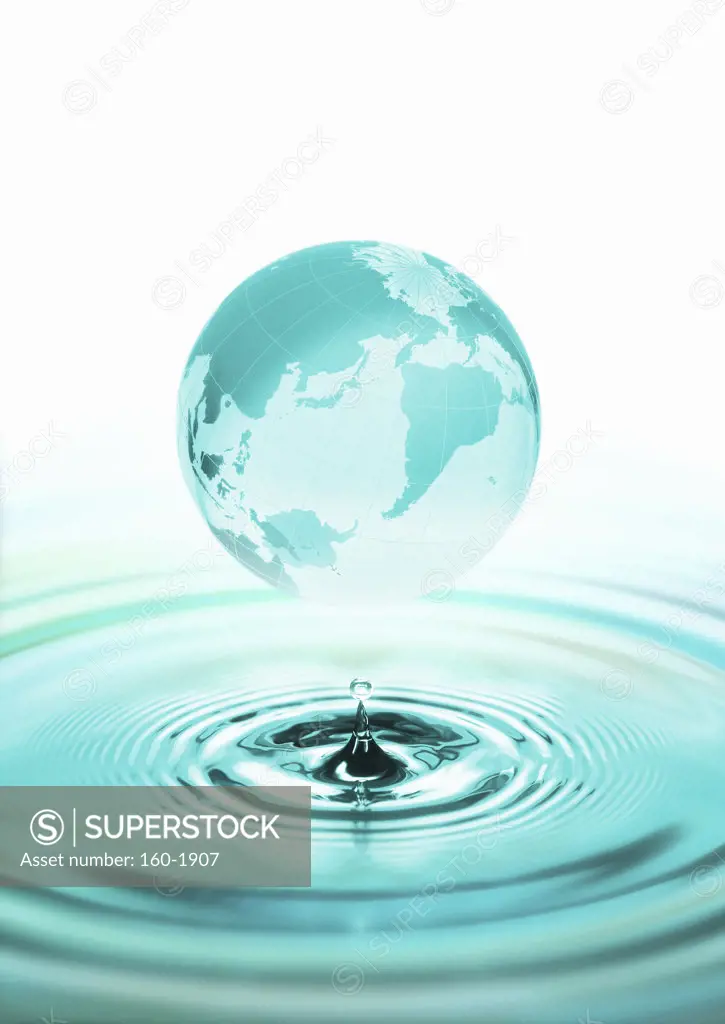 Globe above surface of water, digitally generated image