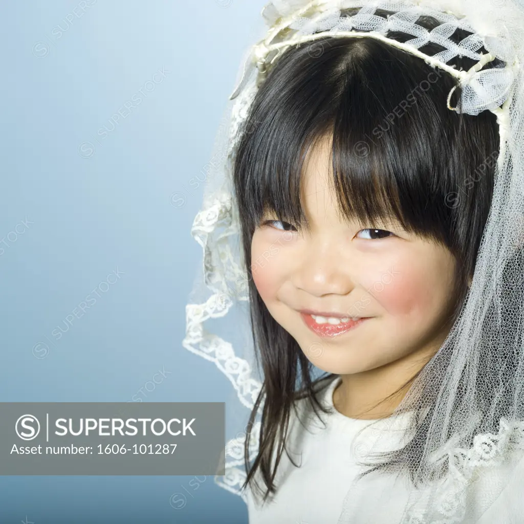 Little girl with wedding veil