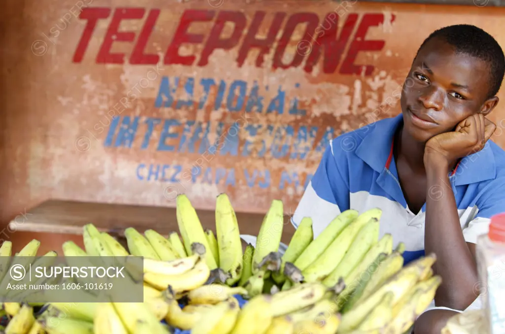 Togo, Lom, Man selling bananas