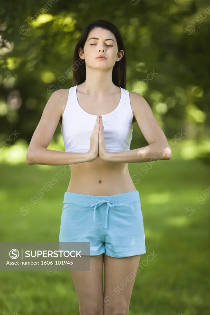Woman practising yoga, outdoors