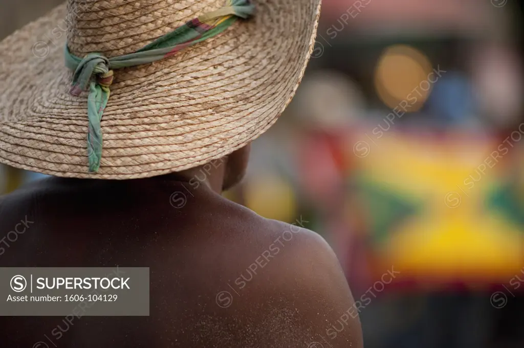 French West Indies, Martinique, Sainte Anne, man with straw hat, rear view