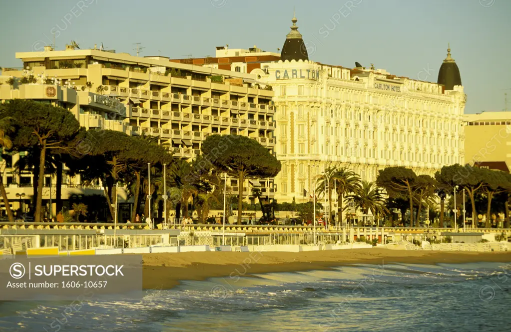 France, French Riviera, Cannes, Carlton Hotel seen from the sea, beach, yellow light