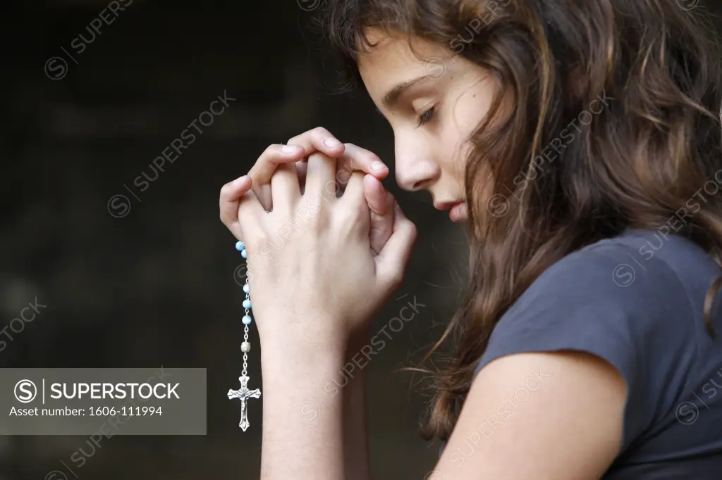France, Bouches-du-Rhne, Arles, Girl praying in a cloister