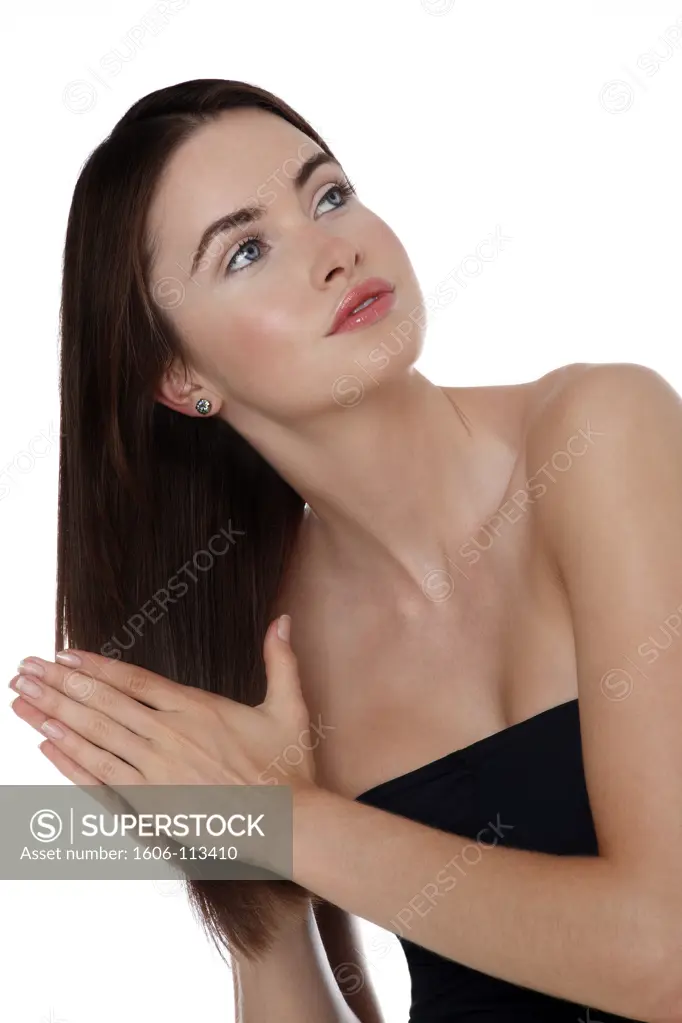 Young woman touching her hair