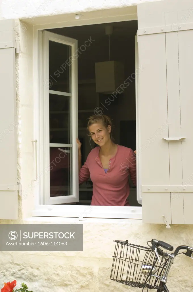Teenage girl at window