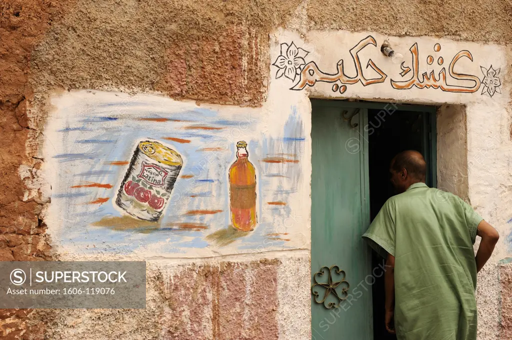 Algeria, Sahara, Gourara, Timimoun, man entering grocery store