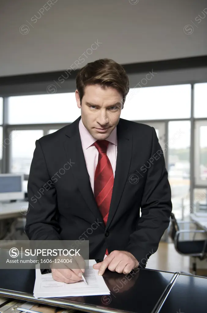 Businessman filling out a paper