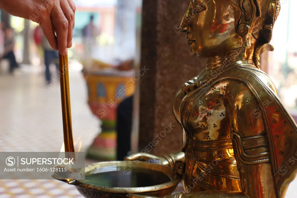 Vietnam, Ho Chi Minh City, Mariamman Temple.  Oil lamp and incense sticks.   Vietnam.