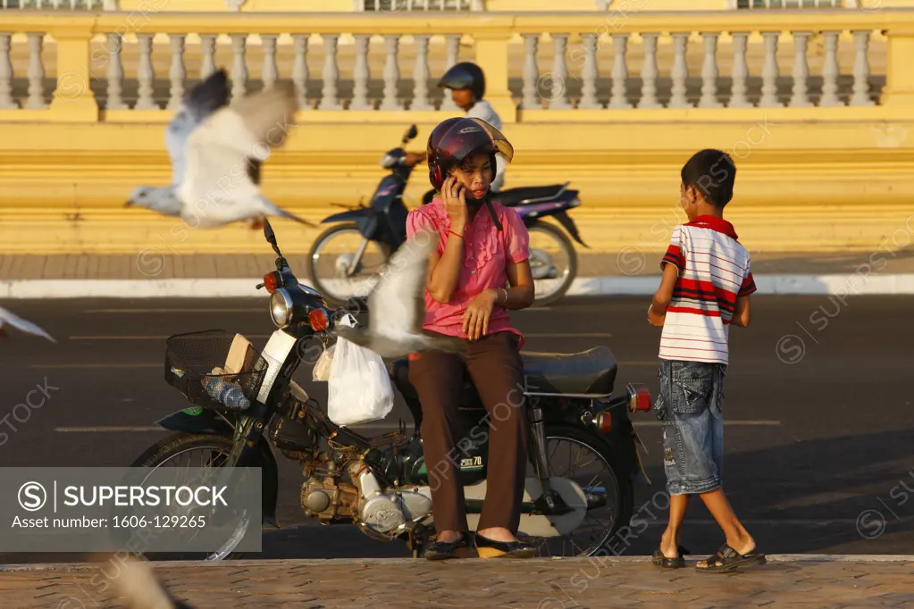 Cambodia, Phnom Penh. Young woman with cell phone.  Cambodia.